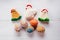 Colorful crocheted Easter chickens and eggs against wooden background