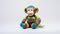 Colorful Crocheted Monkey Toy On White Background