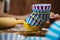 Colorful cupcake wrappers with baking pan on wooden background