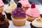 Colorful cupcakes with different Tastes. Small beautifull cakes on white table top. Close up