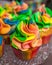 Colorful cupcakes with rainbow cream