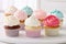 Colorful cupcakes on a white background. Shallow dof, Delight in a collection of beautifully crafted cup, AI Generated