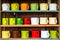 Colorful cups on shelf