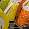 Colorful cups with white dots in a dishwasher