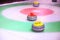 Colorful curling stones on ice
