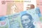 Colorful currency from Angola with Mexican money