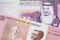 Colorful currency from Angola with Saudi Arabian money