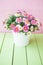 Colorful daisies in white pot