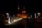 Colorful dancing fountain with mosque in the city at night with lively music