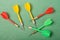 Colorful darts  on a green background