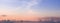 Colorful dawn/dusk sky panorama with clouds .
