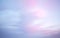 Colorful dawn/dusk sky, with pink and blue clouds, background.