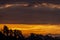 The colorful dawn of a new day over the Tuscan countryside, Italy