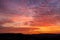 Colorful dawn with spectacular clouds and line of horizon