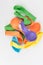 Colorful deflated balloons on white background