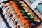 Colorful delicious mouthwatering sushi set.An interesting presentation.