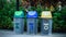 Colorful different types of bins in the park. Symbol for containers and waste separation