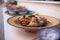 Colorful dish and tajine souvenirs for sale in a shop in Essaouira, Morocco