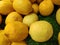 Colorful Display Of Lemons In Market. Ripe yellow lemons,