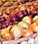 Colorful display of onions, garlic and potatoes.