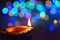 Colorful Diwali traditional oil lamp with blurred LED lights