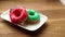 Colorful donuts on the plate.