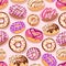 Colorful donuts with sprinkles seamless pattern. Doodle sketch style background.