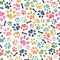 Colorful doodle paw prints and bone seamless pattern for textile design