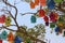 Colorful dovecotes on a tree