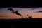 Colorful dramatic sky with cloud, chimneys and smoke at sunset