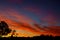 Colorful dramatic sunrise with clouds sky bright horizon burning skies