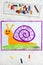 Colorful drawing: Cute smiling snail with purple shell