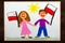 Colorful drawing: Smiling children, boy and girl, waving Polish flags.