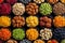 colorful dried fruits, assorted nuts and seeds background. mixed raw food for snacking, top view.