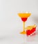 Colorful drink in a margarita glass, red and orange combination, four drinks in a shotglass