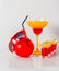 Colorful drink in a margarita glass, red and orange combination, four drinks in a shotglass, sunglasses