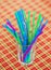 Colorful drink straw in glass