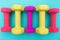 Colorful Dumbbells on Yoga Mat