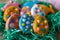 Colorful Easter cookies in shape of eggs in grass