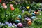 A colorful Easter egg hunt in a garden filled with blooming flowers