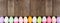 Colorful Easter Egg long bottom border over a rustic wood banner background