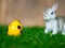 The Colorful easter eggs are in the basket. Placed on green grass. Have a cute rabbit in the back. The back is a brown wood frame.