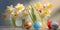 Colorful Easter eggs and daffodils, narcissus flowers, against bokeh background. Easter decoration