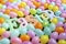 Colorful Easter eggs and Easter banner letters on artificial grass