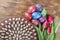 Colorful easter eggs, easter cake and tulips