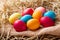 Colorful Easter eggs in a hay