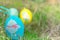Colorful easter eggs hiding on the grass, ready for the egg hunter traditional