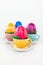 Colorful easter eggs in little cups