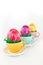 Colorful easter eggs in little cups in a row