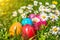 Colorful Easter eggs lying in the grass